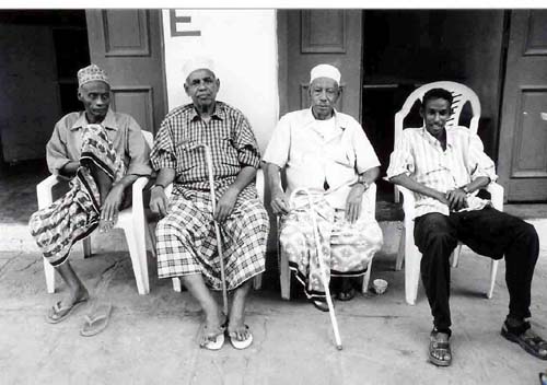 4 Muslim amigos in chairs - Mombassa Kenya